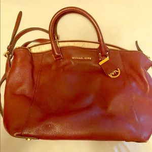 Micheal Kors purse. Burgundy in color